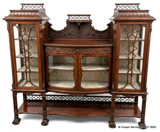 A Fine Art Nouveau Mahogany Salon Cabinet Display. Early 1900. In the style of Gillows having twin pagoda tops with fretted upstands below are twin doors with art nouveau stylized moldings opening to reveal triple shelves,the interiour lined with the original brocade lining. To the centre a bow fronted two door cabinet with carved and fretted upstand ,molded top over two doors enclosing a single shelf again lined in the original brocade. All raised on reeded legs linked with a shaped undershelf with matching pierced upstand and carved paw feet. Height 59.5 in, Width 66 in, Depth 16 inches. A Fine Art Nouveau Mahogany Salon Cabinet Display. Early 1900. In the style of Gillows having twin pagoda tops with fretted upstands below are twin doors with art nouveau stylized moldings opening to reveal triple shelves,the interiour lined with the original brocade lining. To the centre a bow fronted two door cabinet with carved and fretted upstand ,molded top over two doors enclosing a single shelf again lined in the original brocade. All raised on reeded legs linked with a shaped undershelf with matching pierced upstand and carved paw feet. Height 59.5 in, Width 66 in, Depth 16 inches.