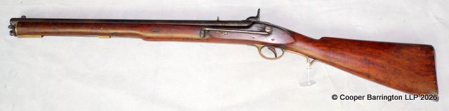A19th Century Indian Percussion Cavalry Carbine with 54cm Barrel. The lock plate marked with a CROWN and AOCO TOWER  with walnut stock and stirrup ramrod 93cm overall.The hammer sits in cocked and half cocked positions well and releases properly.
