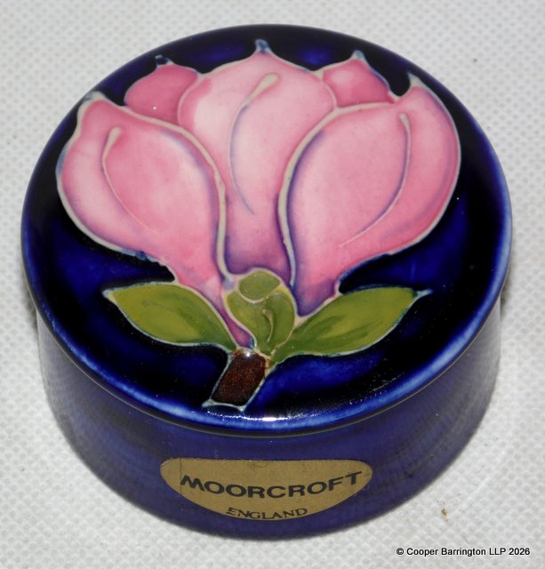 Moorcroft Lidded Trinket Box Featuring the Magnolia Pattern on Cobalt Blue Ground. Diameter 6.7 cm. Moorcroft Lidded Trinket Box Featuring the Magnolia Pattern on Cobalt Blue Ground. Diameter 6.7 cm.